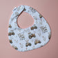 Baby bib with farm design of tractors, chickens and cows