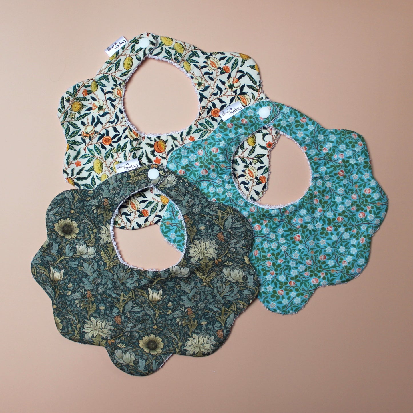 Set of 3 scallop shaped baby bibs in William Morris inspired designs