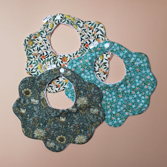 Set of 3 scallop shaped baby bibs in William Morris inspired designs