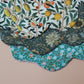Set of 3 scallop shaped baby bibs in William Morris inspired designs