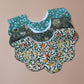 Set of 3 scallop shaped baby bibs in William Morris inspired designs