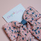 Pink hair bow with ditsy blue flowers