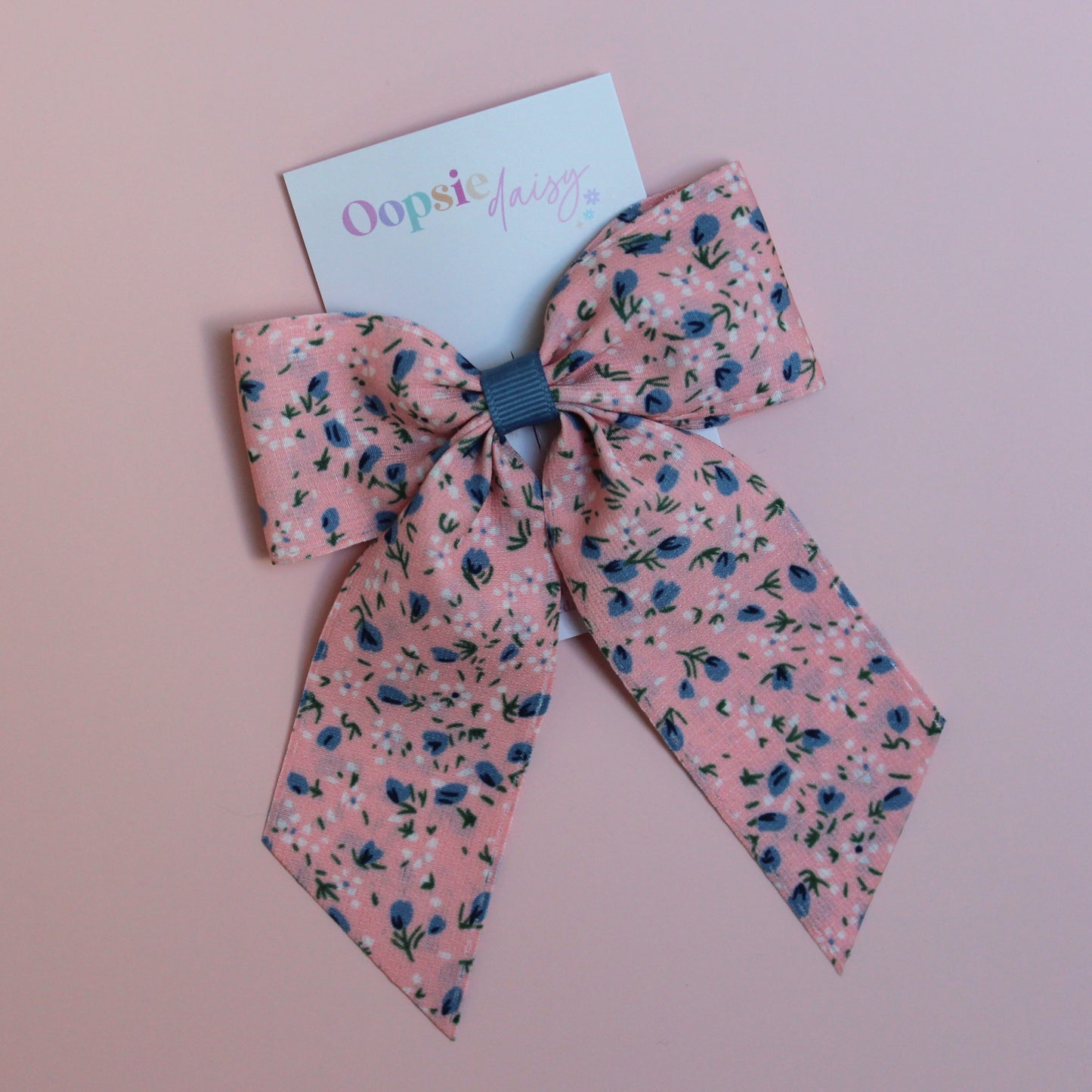 Pink hair bow with ditsy blue flowers