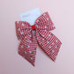 red and white gingham hair bow with flowers
