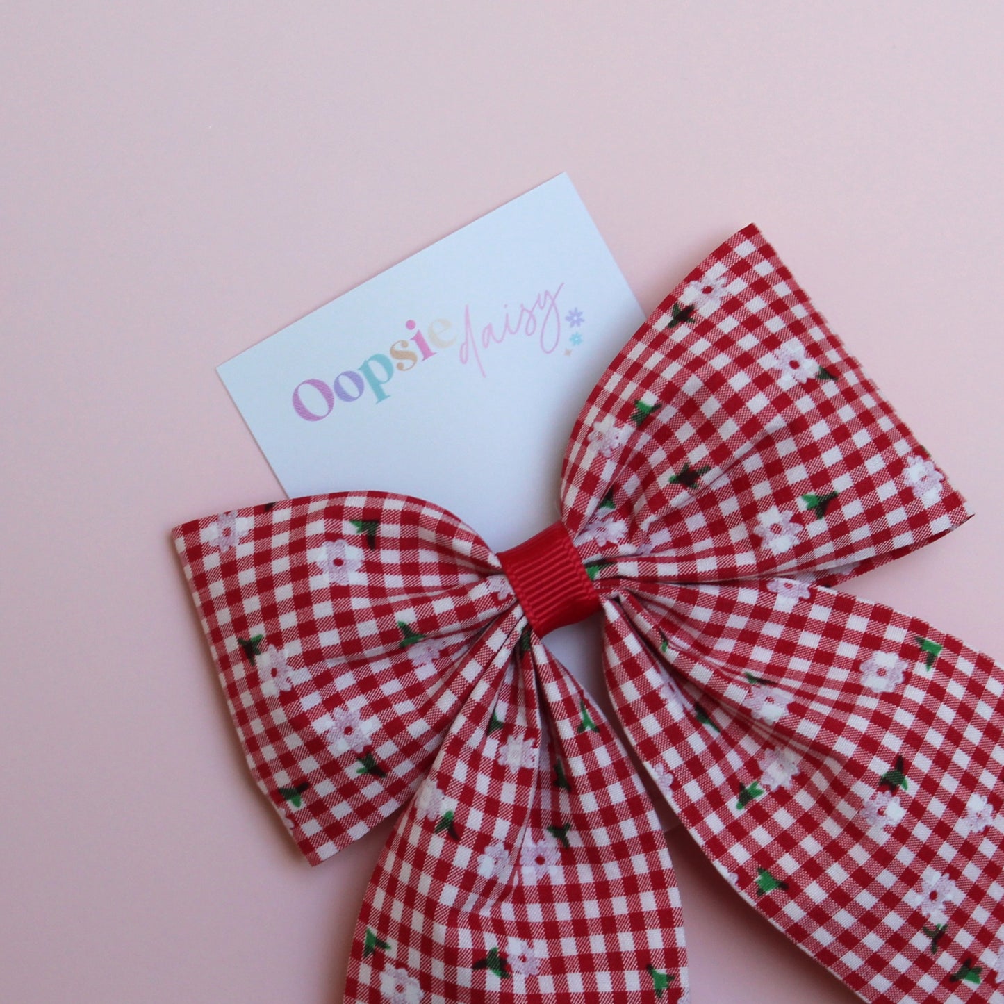 red and white gingham hair bow with flowers