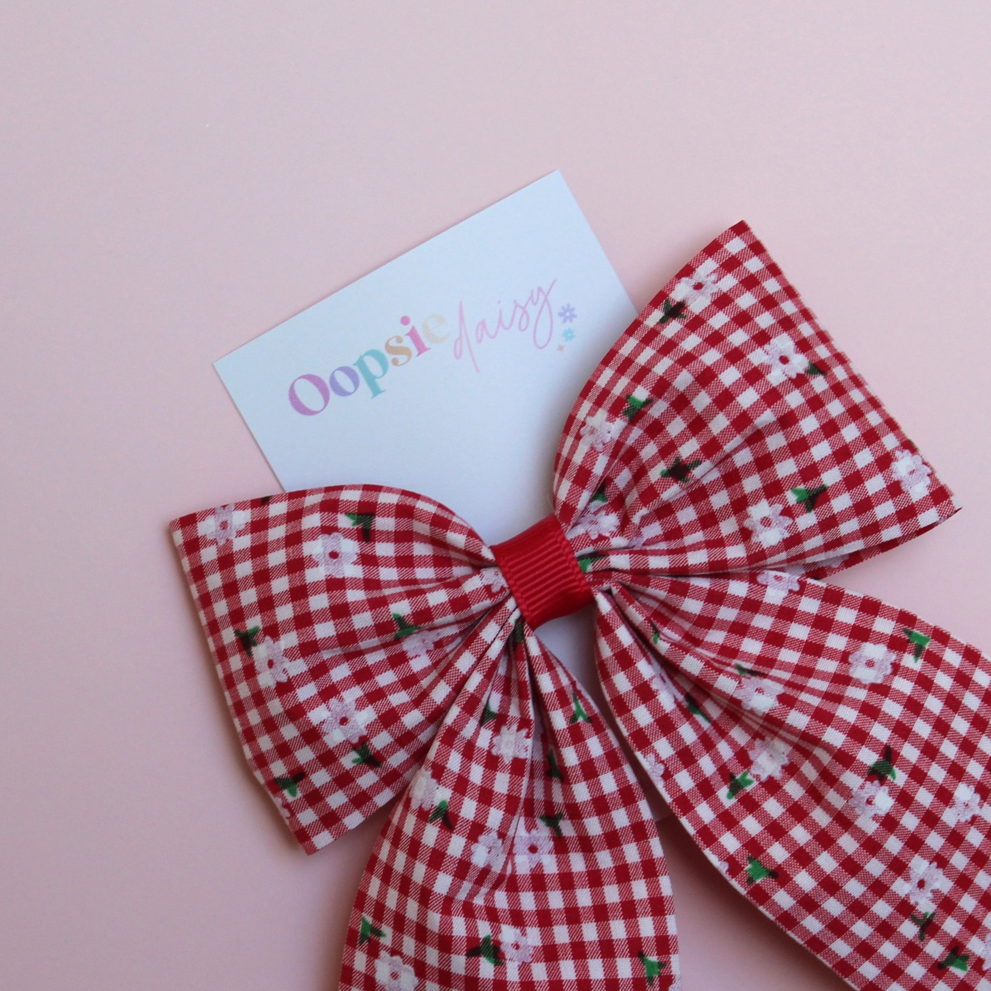 red and white gingham hair bow with flowers