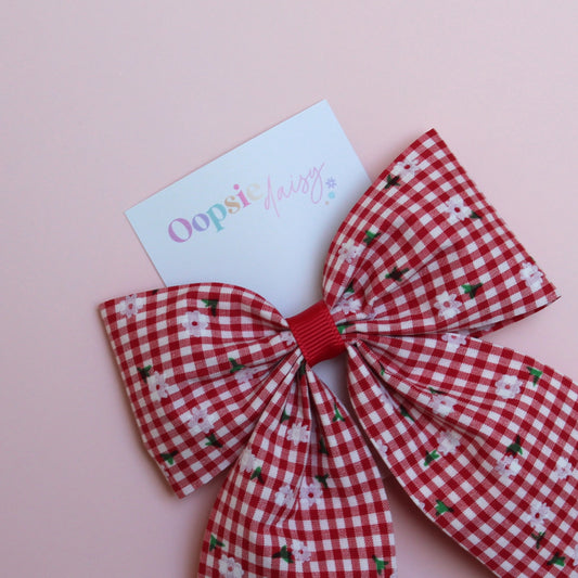 red and white gingham hair bow with flowers