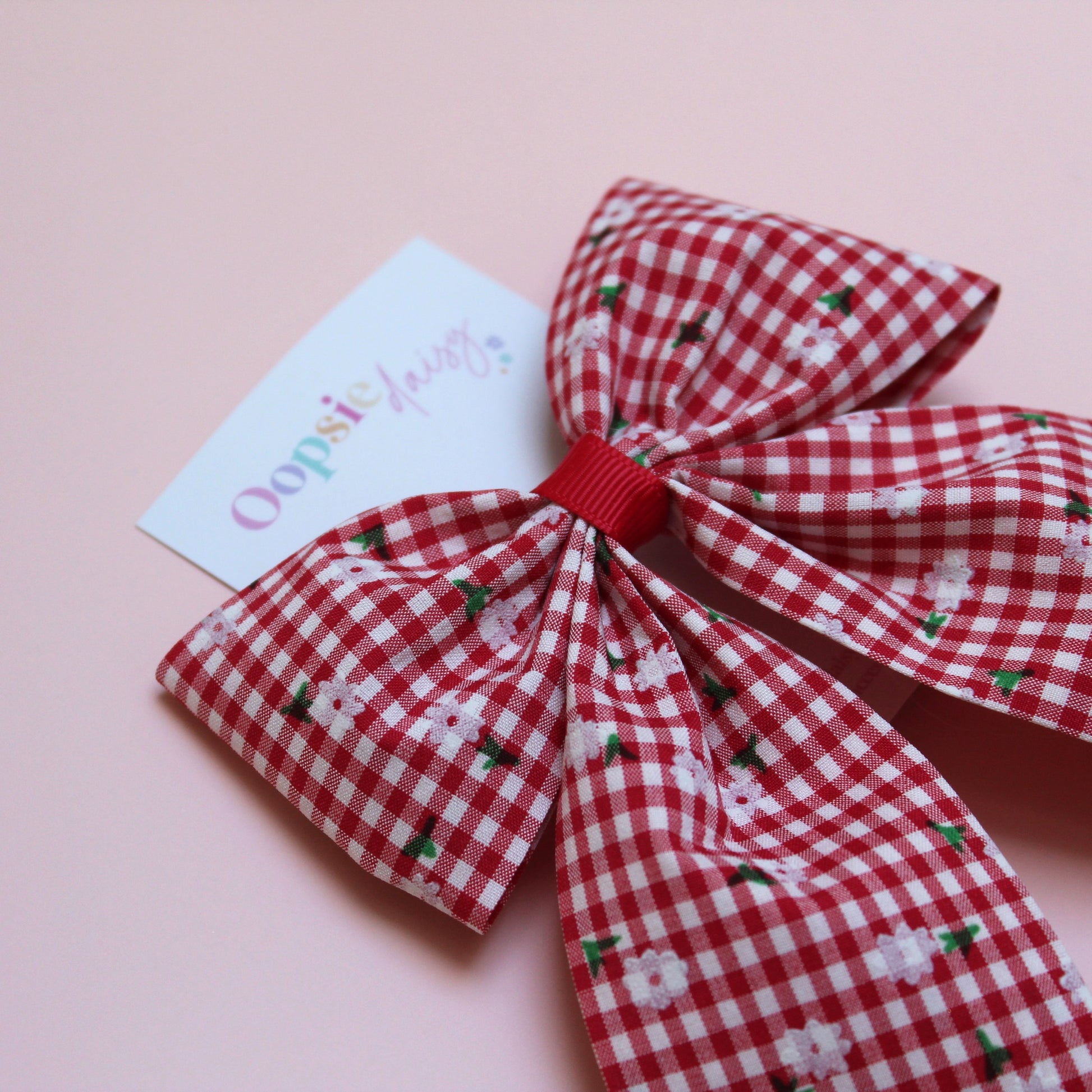 red and white gingham hair bow with flowers