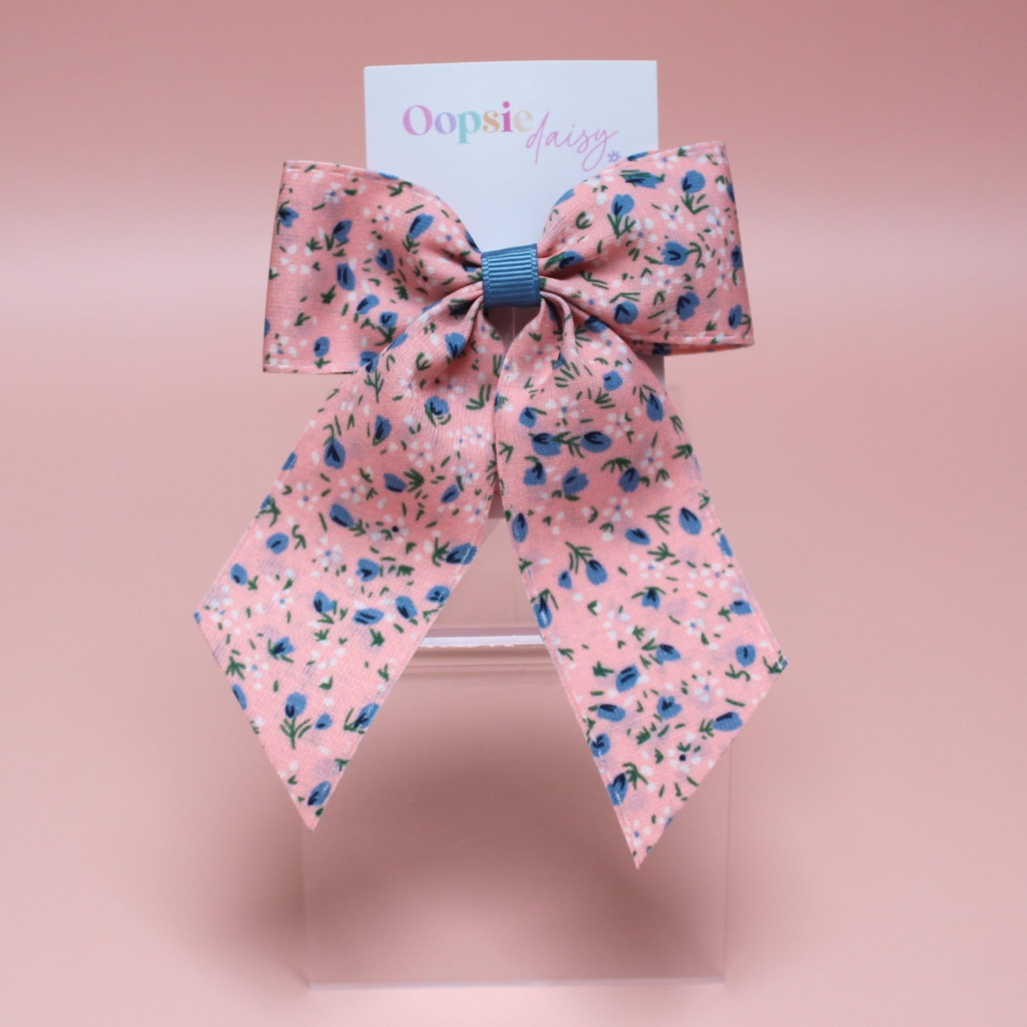 Pink hair bow with ditsy blue flowers