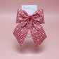 red and white gingham hair bow with flowers