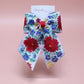 Floral patterned hair bow with red and blue flowers