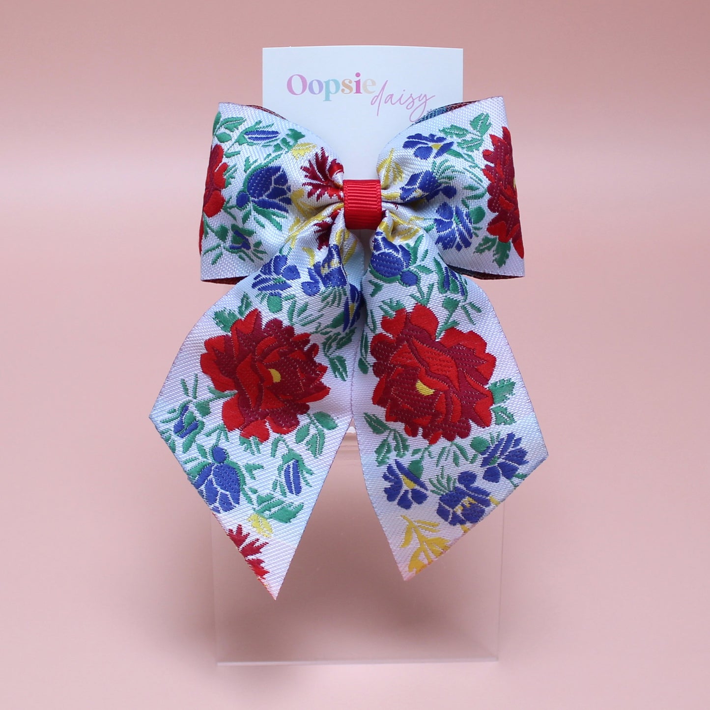 Floral patterned hair bow with red and blue flowers