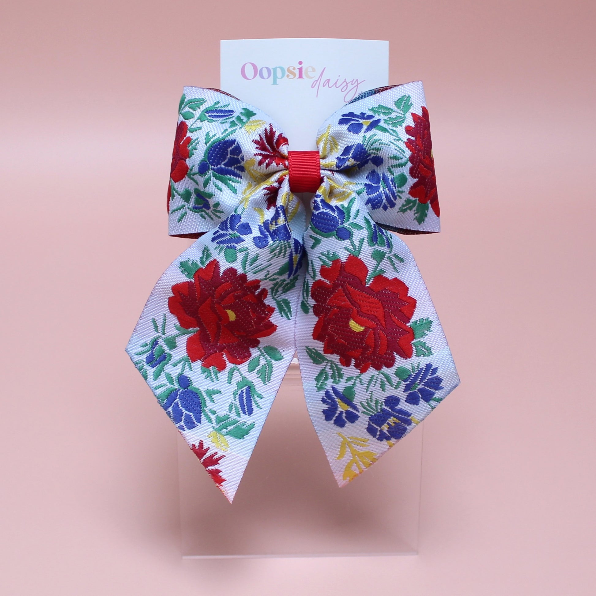 Floral patterned hair bow with red and blue flowers