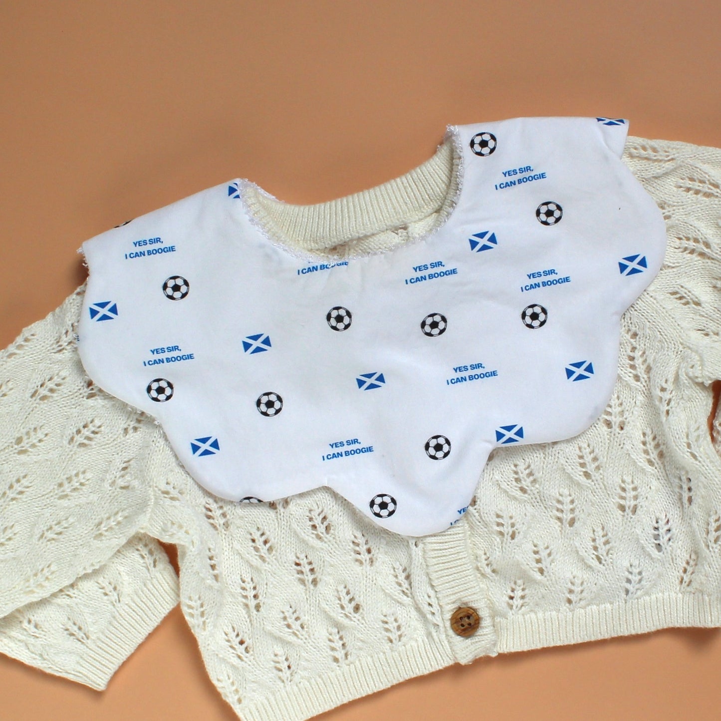 Scotland football baby bib with scotland flag, footballs and Yes sir, I can boogie slogan