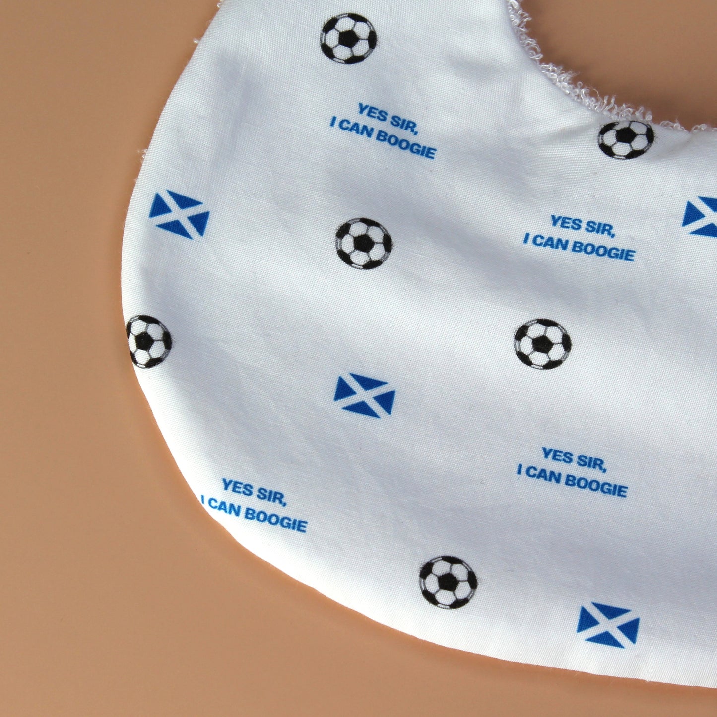 Scotland football baby bib with scotland flag, footballs and Yes sir, I can boogie slogan
