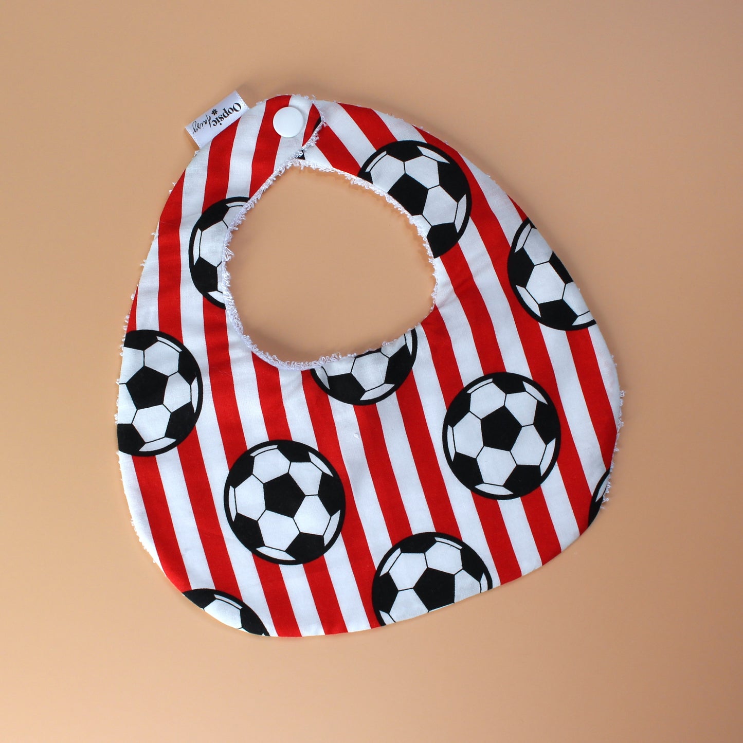Red and white striped football baby bib
