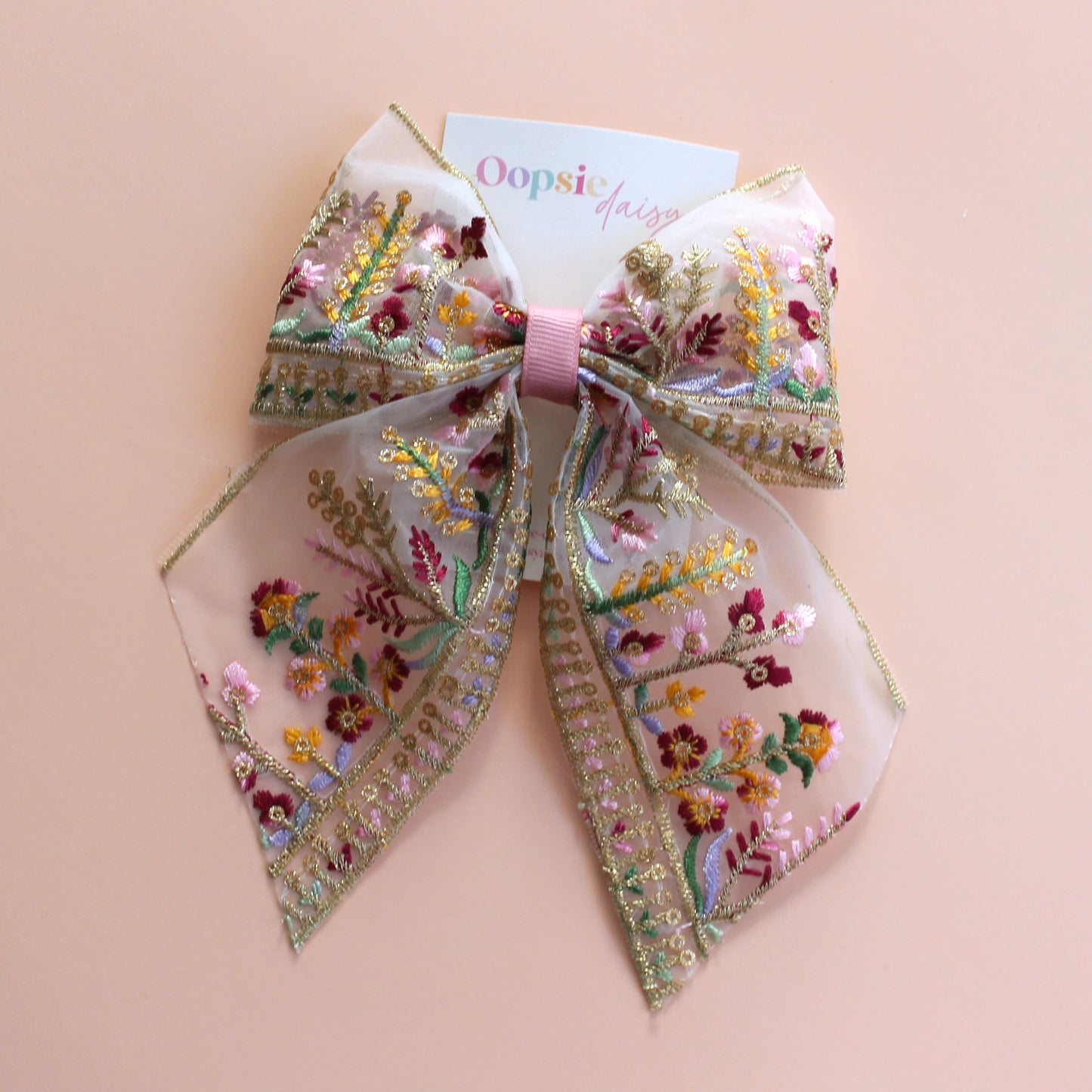 Transparent hair bow with colourful burgundy and gold embroidered floral pattern