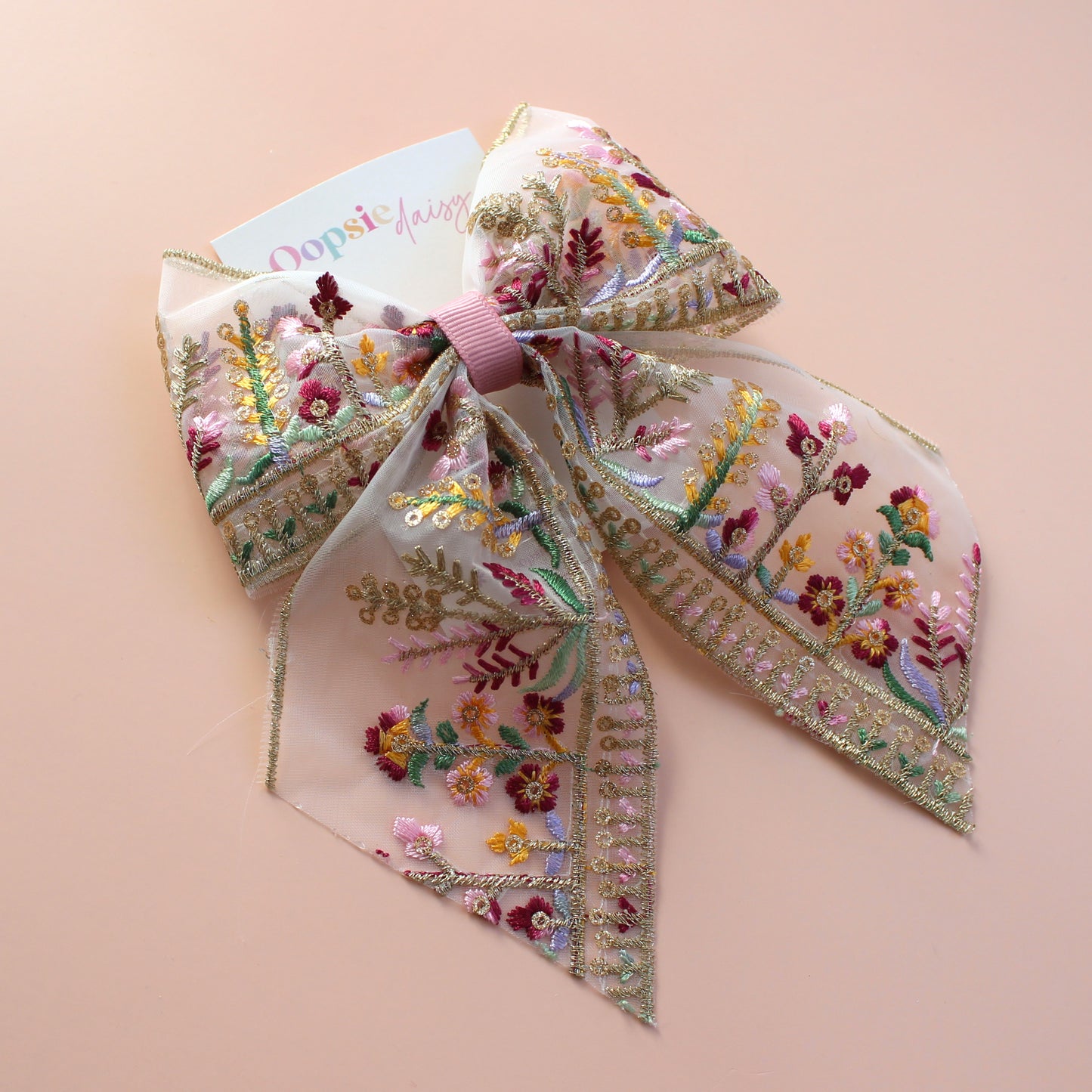 Transparent hair bow with colourful burgundy and gold embroidered floral pattern