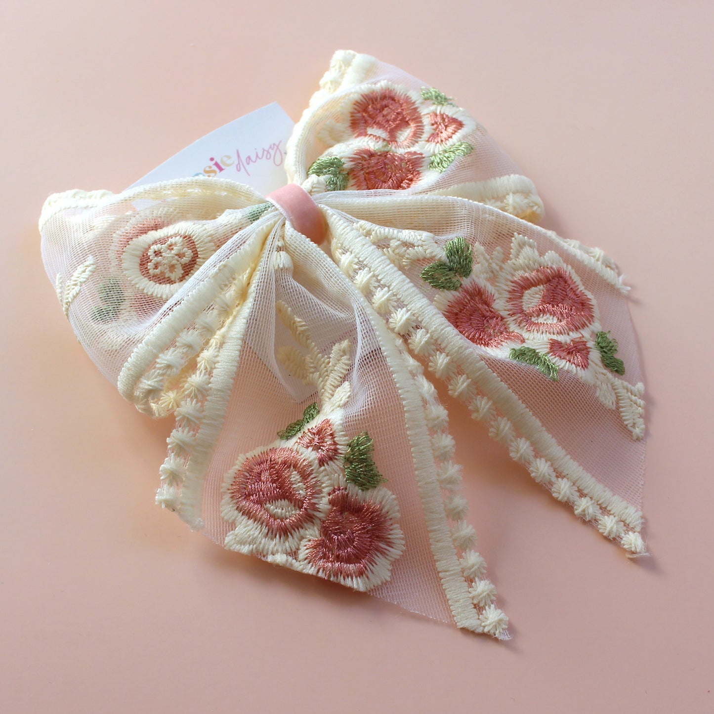 Sheer lace hair bow with cream and pink embroidered flowers
