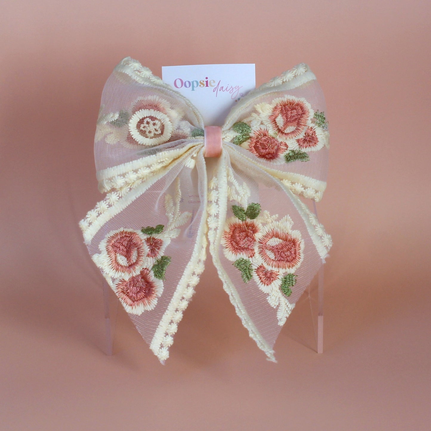 Sheer lace hair bow with cream and pink embroidered flowers