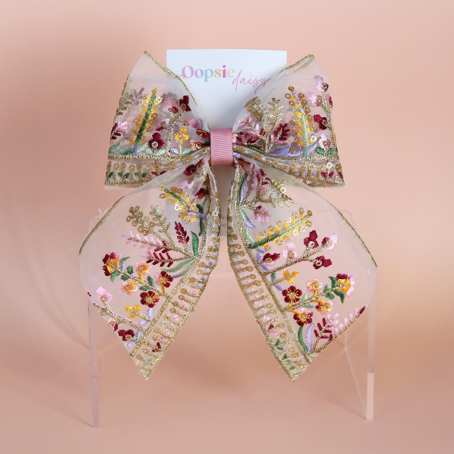 Transparent hair bow with colourful burgundy and gold embroidered floral pattern