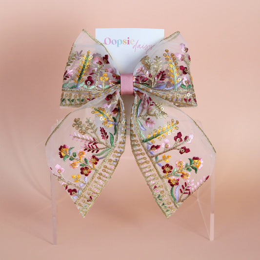Transparent hair bow with colourful burgundy and gold embroidered floral pattern