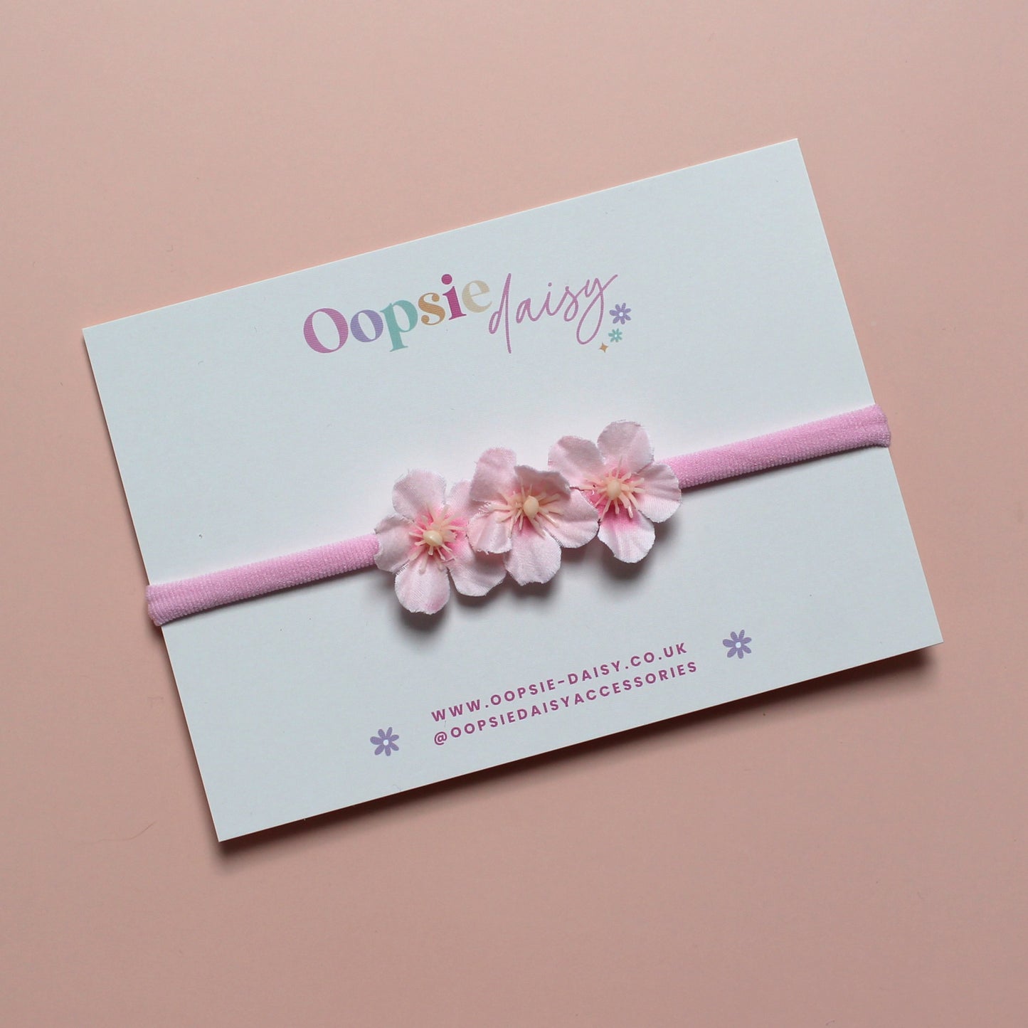 Pink baby headband with 3 pink flowers
