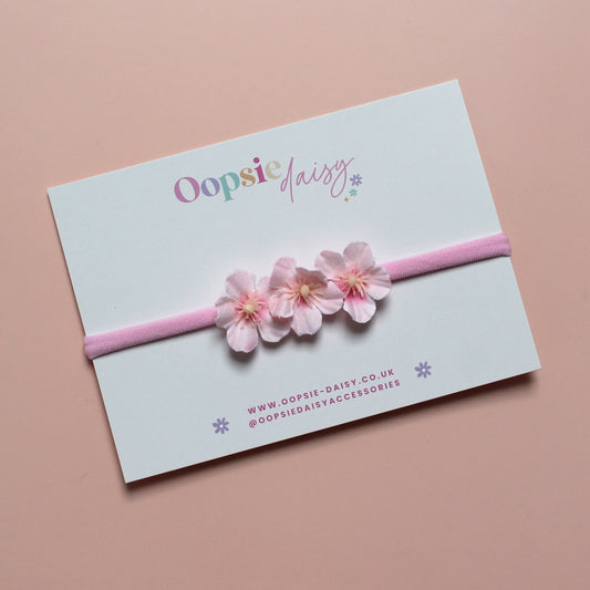 Pink baby headband with 3 pink flowers