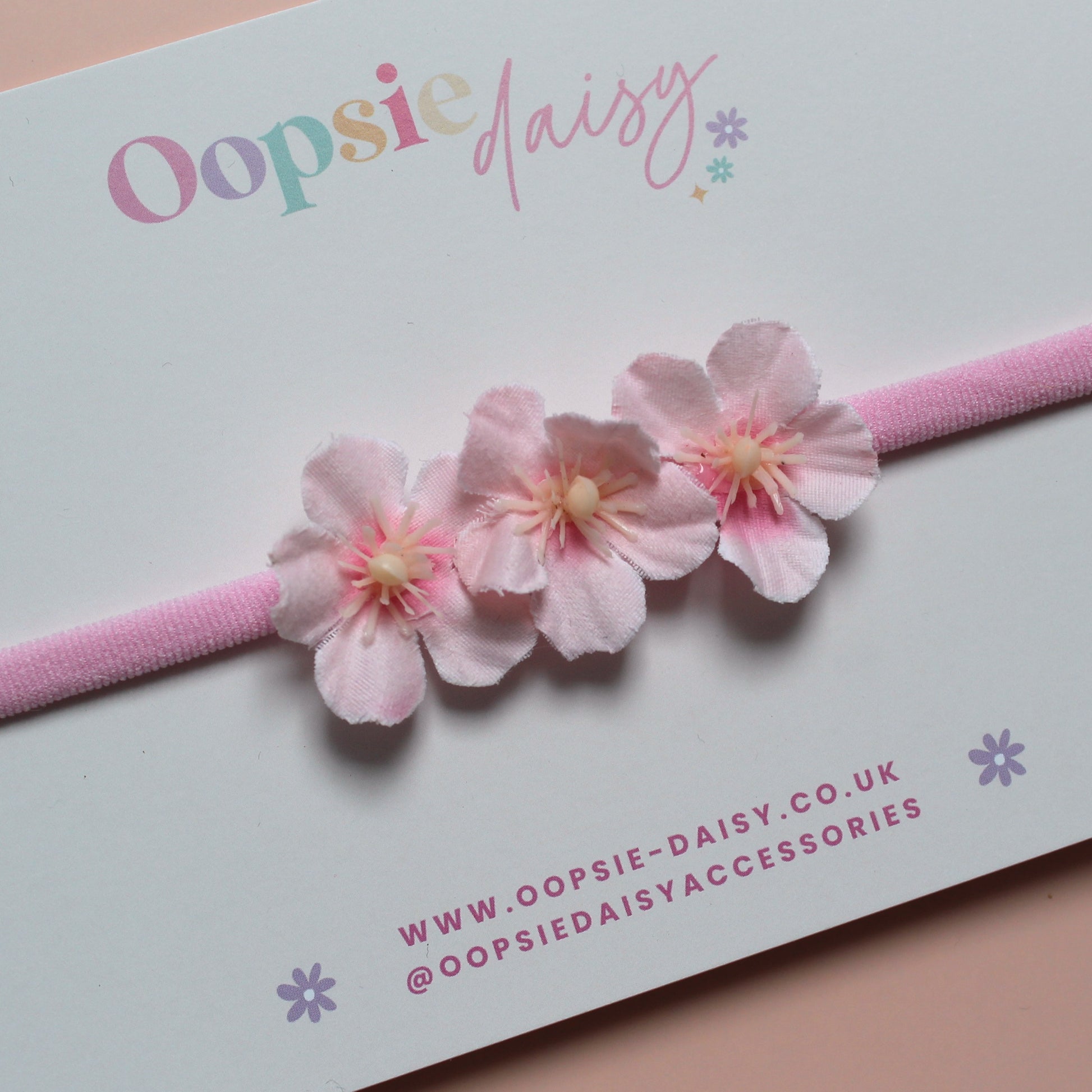 Pink baby headband with 3 pink flowers