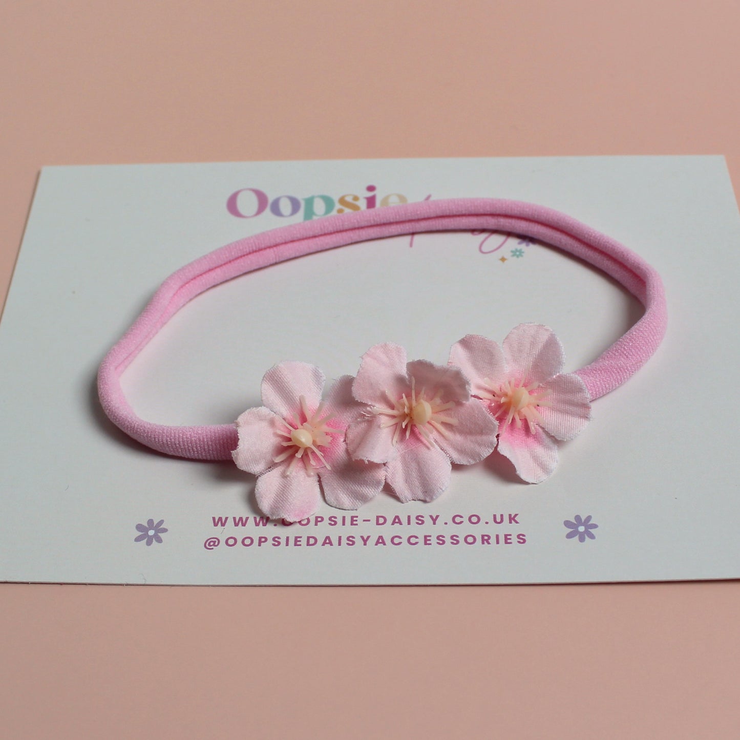 Pink baby headband with 3 pink flowers