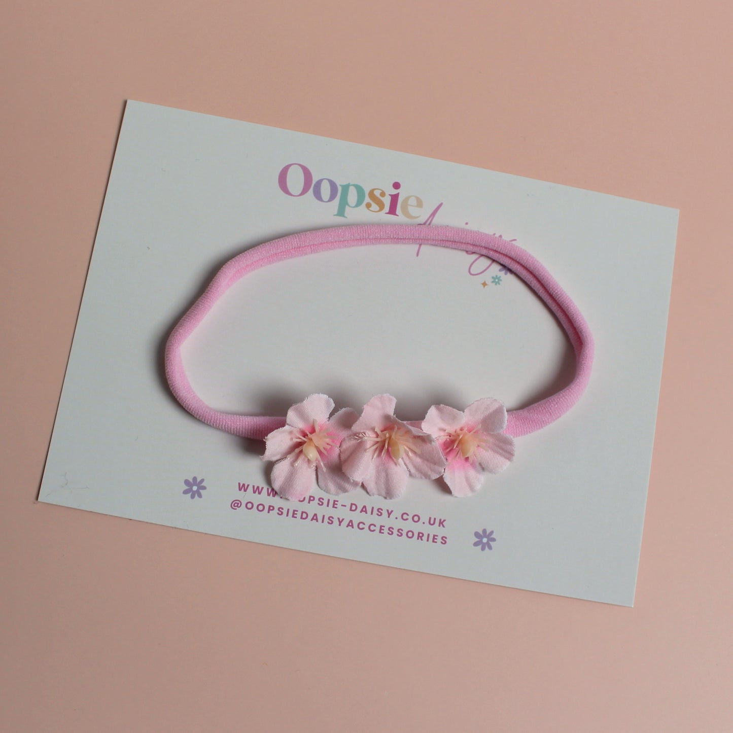 Pink baby headband with 3 pink flowers