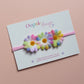 Pink baby headband with 3 multicolour daisy flowers