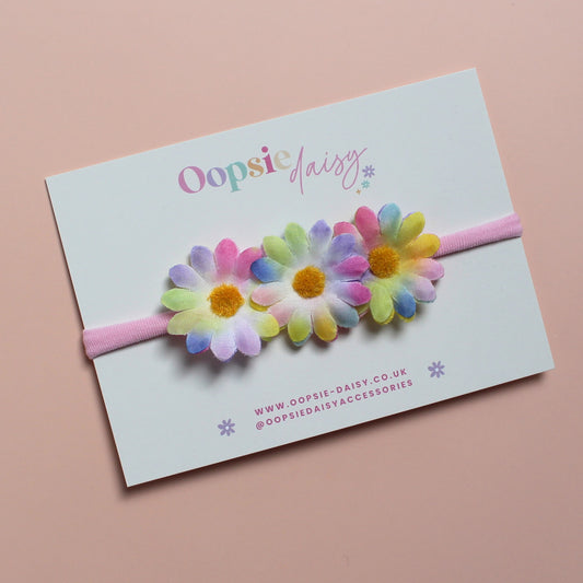 Pink baby headband with 3 multicolour daisy flowers