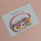 Pink baby headband with 3 multicolour daisy flowers