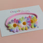 Pink baby headband with 3 multicolour daisy flowers