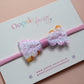 Pink baby headband with colourful lace bow