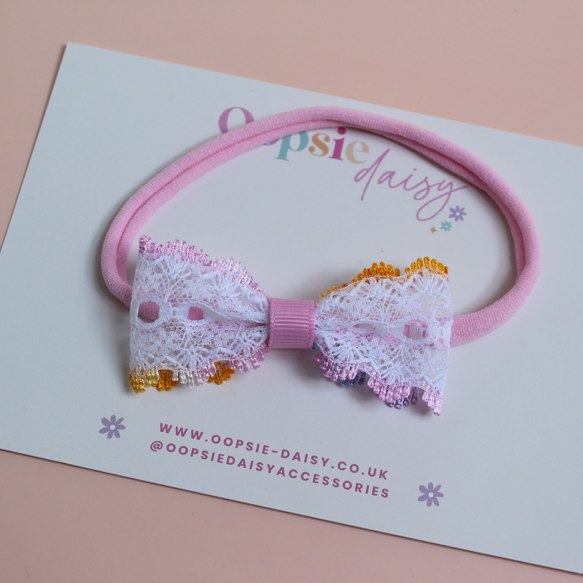 Pink baby headband with colourful lace bow