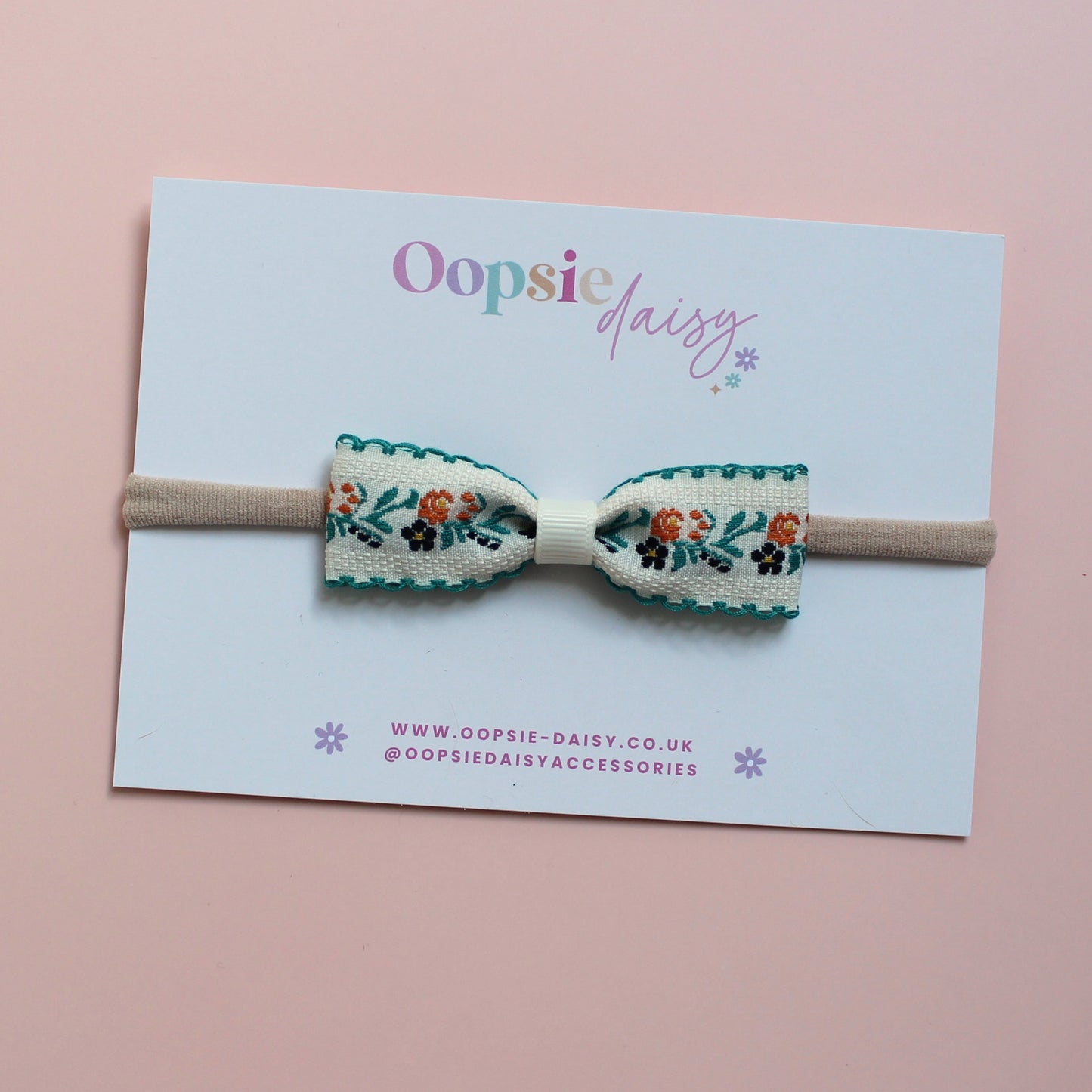 Baby headband with cream and green floral bow