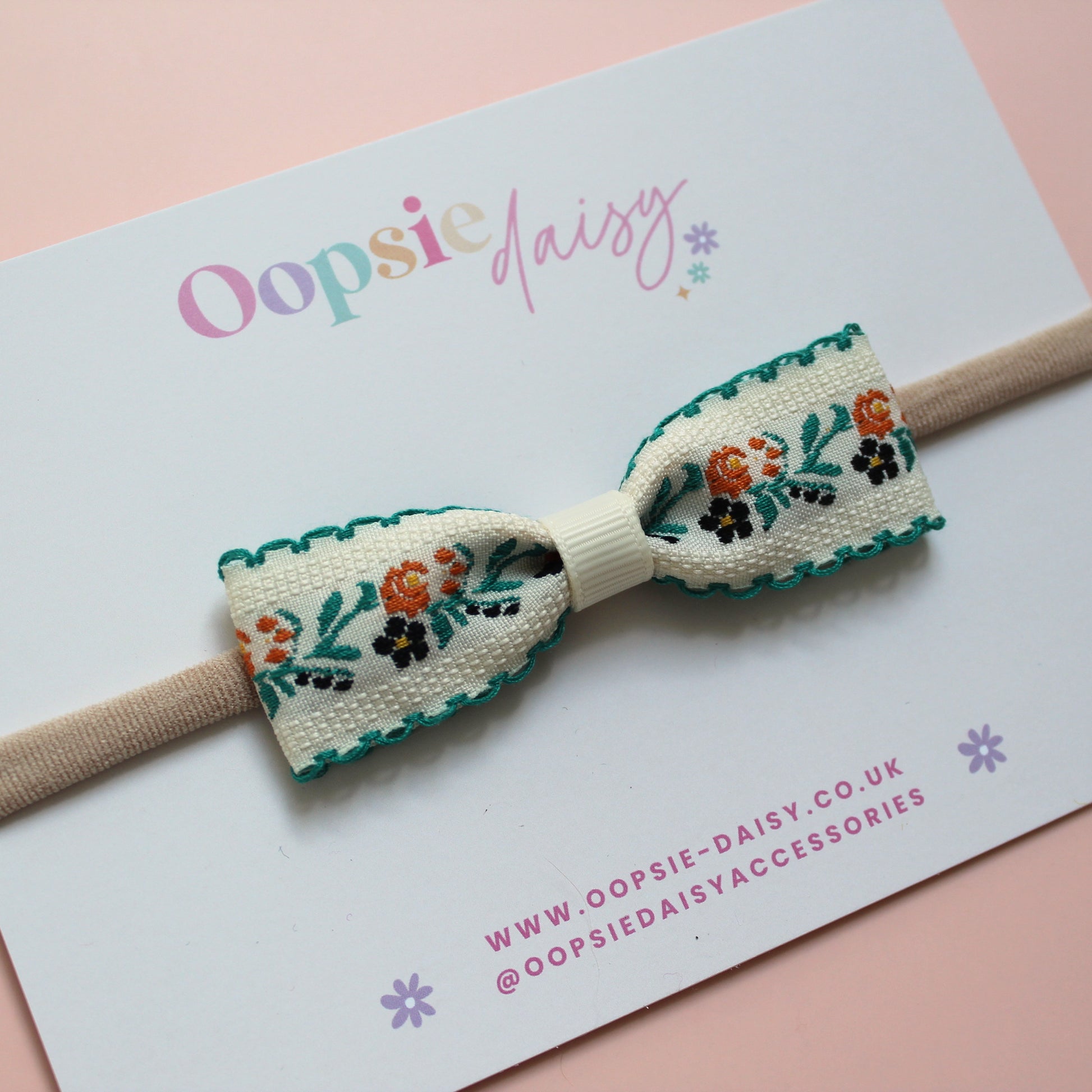 Baby headband with cream and green floral bow