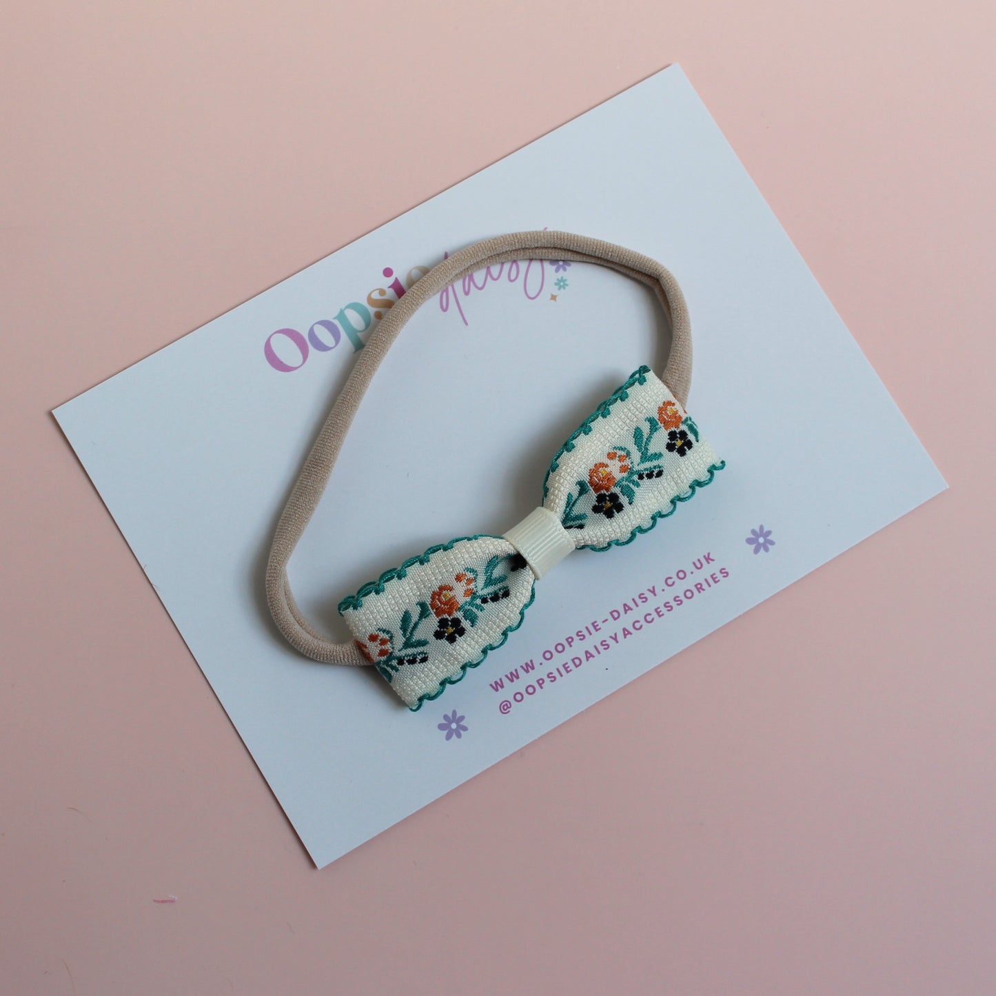 Baby headband with cream and green floral bow