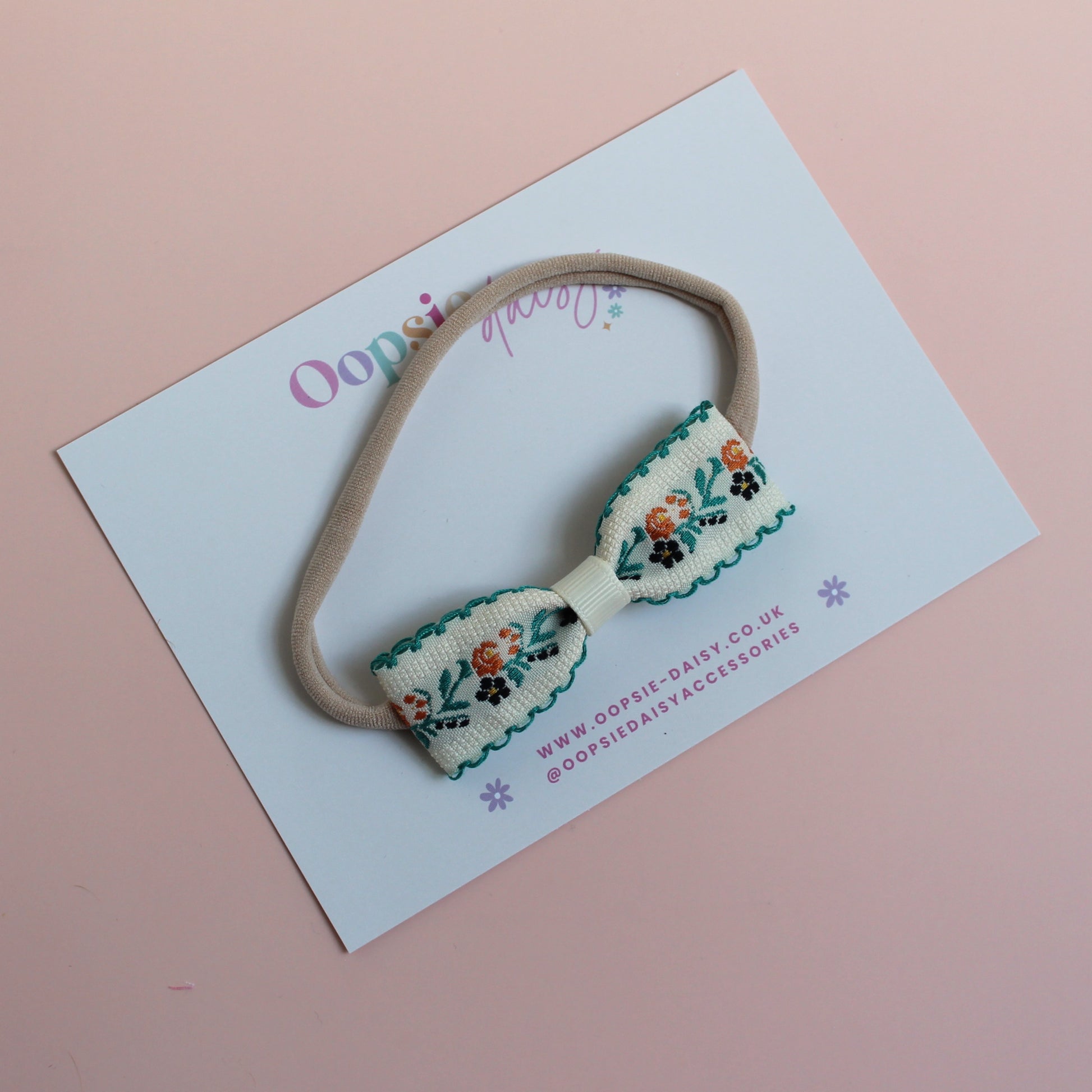 Baby headband with cream and green floral bow