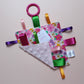 Sensory crinkle tag toy with pink floral pattern
