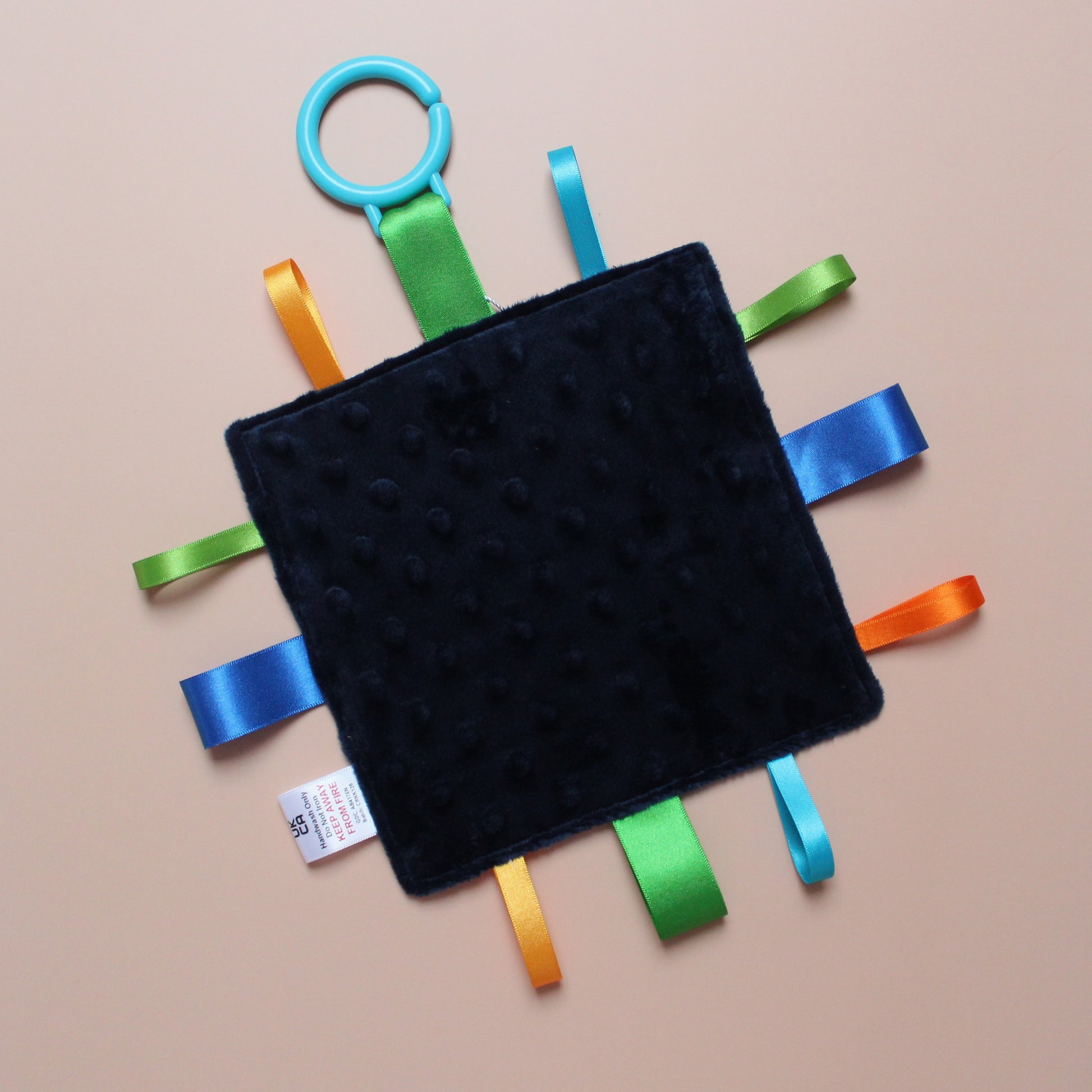 Sensory crinkle tag baby toy with dinosaur pattern