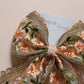 Embroidered floral hair bow with peach and rose gold shimmer