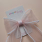 Light pink organza hair bow with pearls