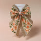 Embroidered floral hair bow with peach and rose gold shimmer