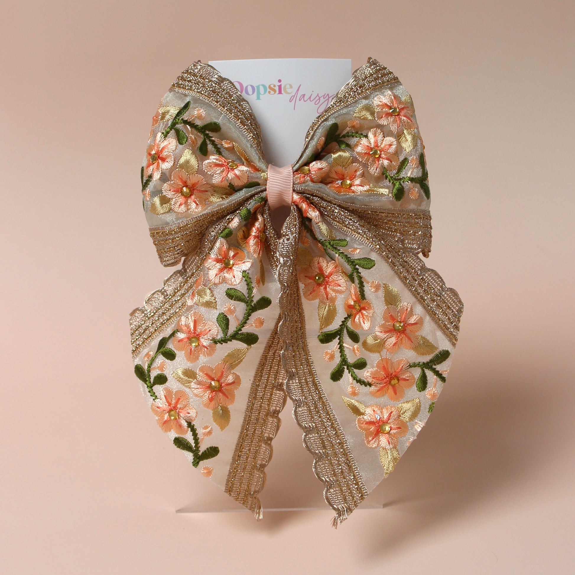Embroidered floral hair bow with peach and rose gold shimmer
