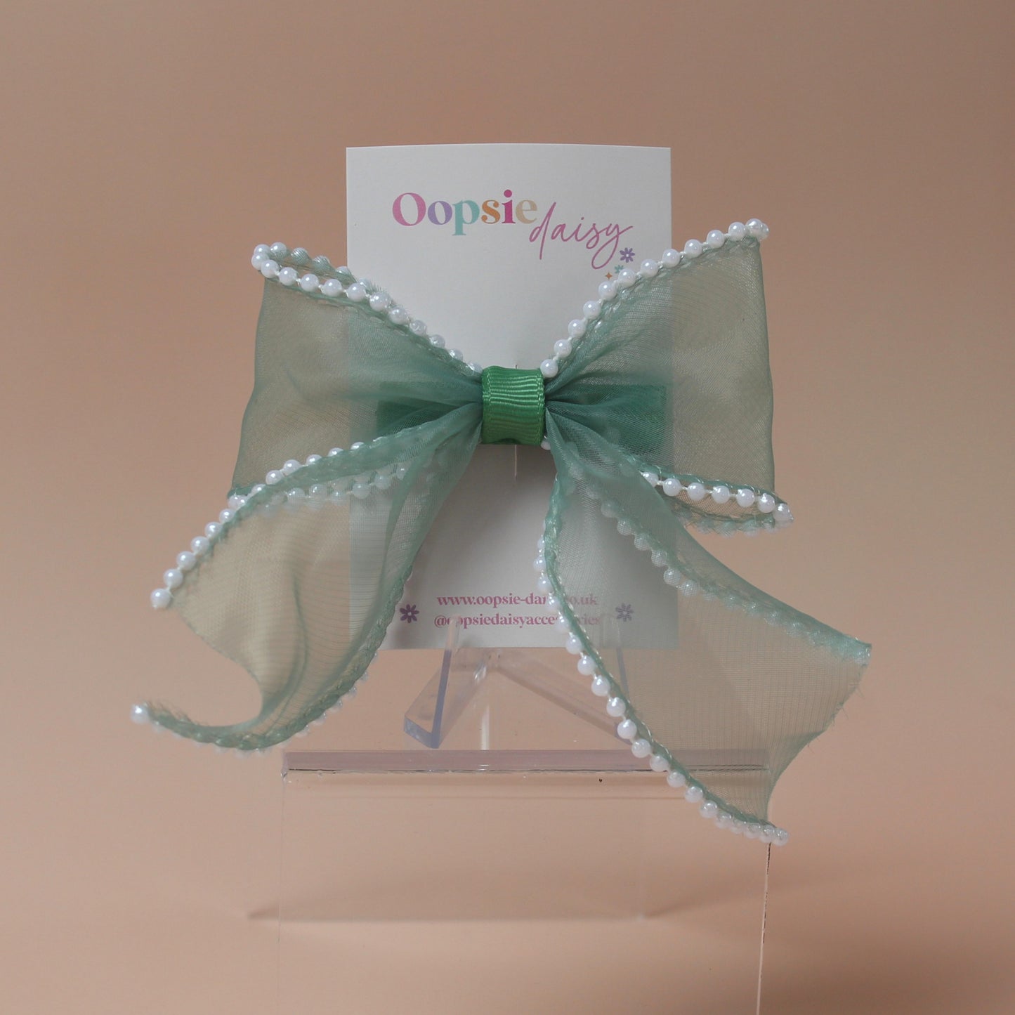 Green organza hair bow with pearls